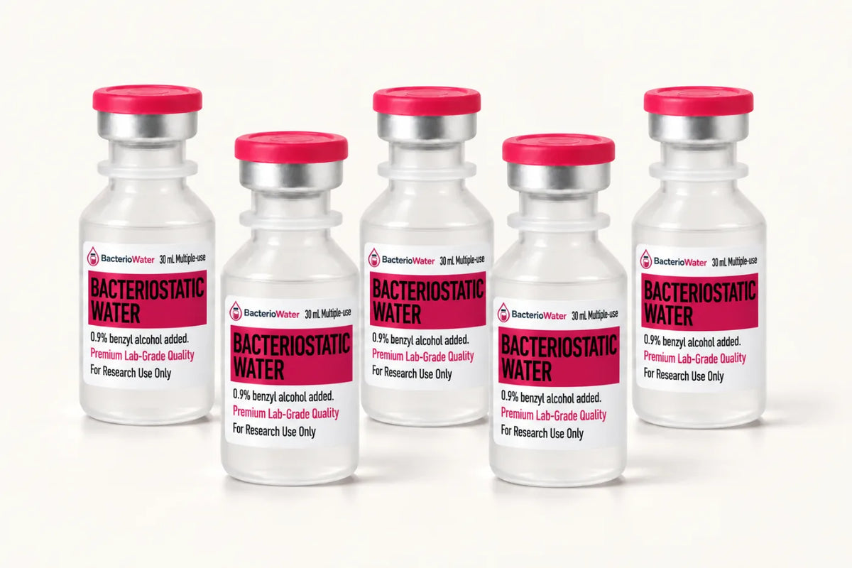 Group of sealed 30 mL bacteriostatic water vials with pink flip-off caps from a single production lot